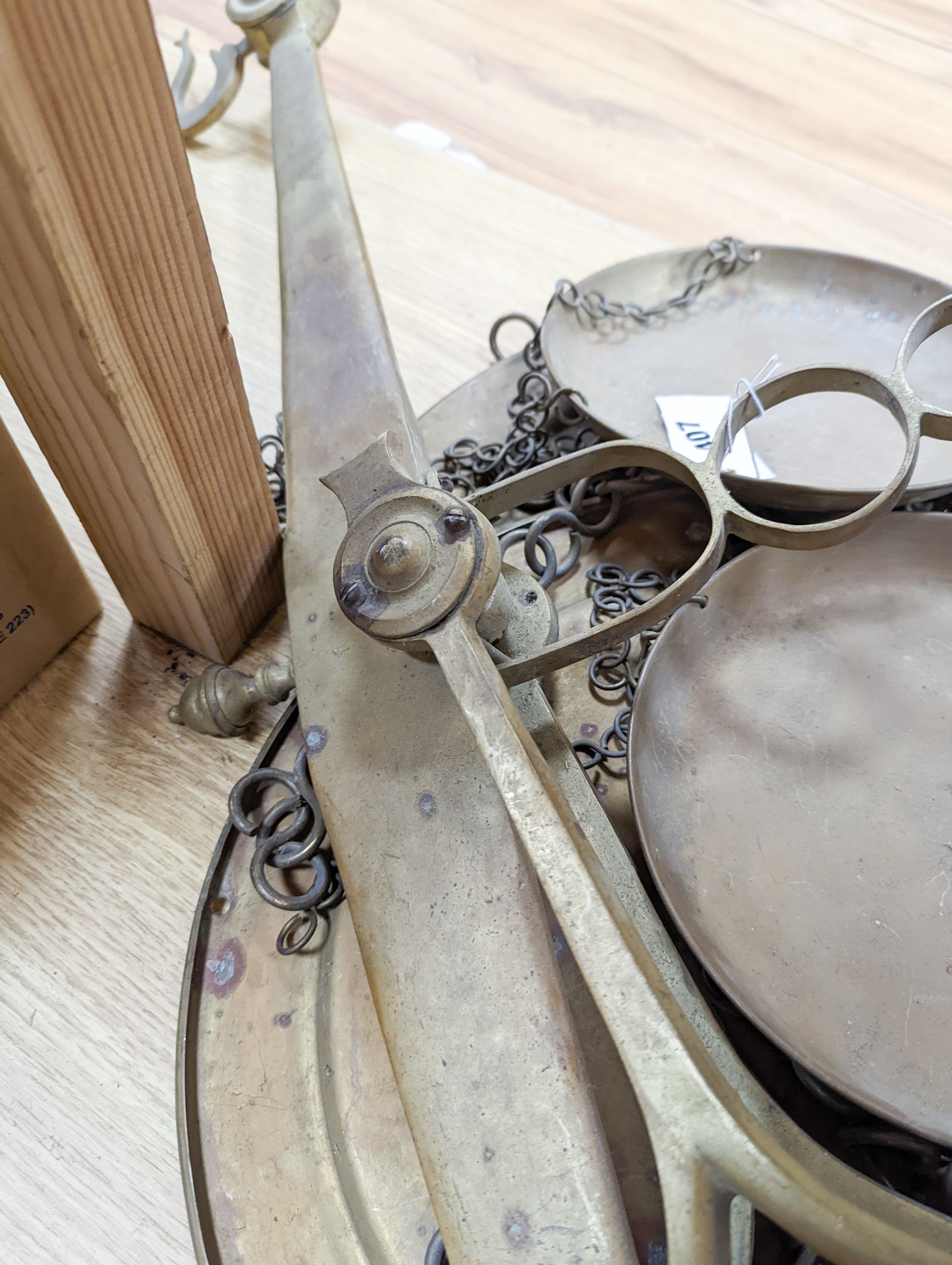 A large set of brass hanging scales, 91cm across